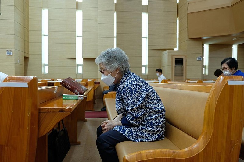 Social distancing rules limit the number of congregants who can gather for religious services. Here, a woman worships at Gyesan Jeil Church in Incheon, South Korea.
(The Washington Post/Min Joo Kim)