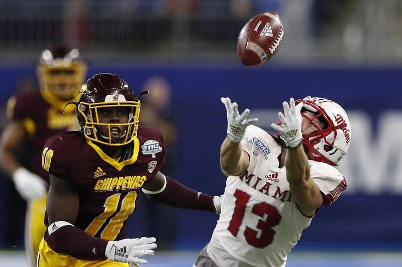 Miami of Ohio wide receiver Jack Sorenson attempts to catch a pass as Central Michigan’s LaQuan Johnson defends during the Mid-American Conference Championship Game last year. The MAC announced Friday it will have a six-game football season starting in November, making it the last of the 10 major conferences to say it will play this fall.
(AP file photo)