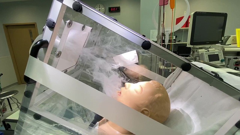 A modified intubation box is shown in this undated handout photo. The clear plastic barrier is placed over the head and upper body of a patient, but the modification at left is a vent similar to the range hood over a kitchen stovetop. Little Rock native Cameron H. Good said the vent has shown promise in drawing out aerosol droplets that could contain the novel coronavirus, thereby helping to protect medical workers.