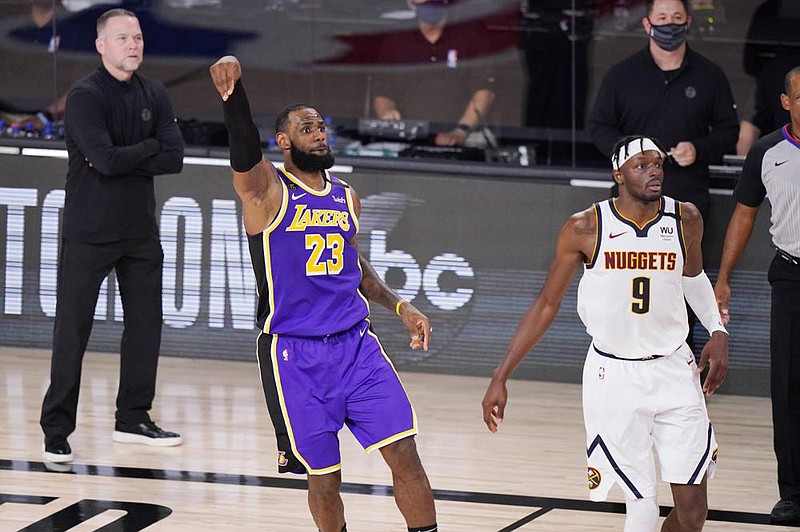 LeBron James of the Los Ange- les Lakers scored 38 points, grabbed 16 rebounds and had 10 assists to lead the Lakers to a 117-107 victory over the Denver Nuggets in Game 5 of the NBA Western Conference finals, which earned the Lakers a trip to the NBA Finals. 
(AP Photo/Mark J. Terrill) 