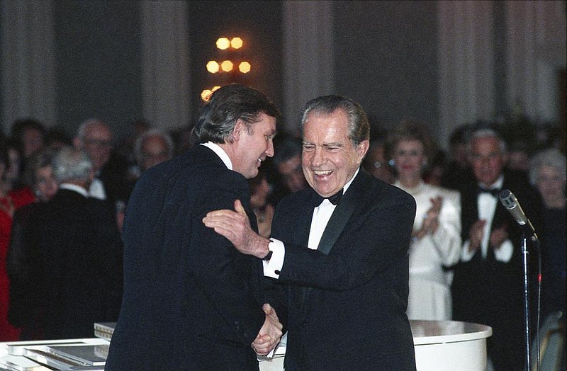 Donald Trump and former President Richard Nixon shake hands on March 11, 1989, at a tribute gala to Nellie Connally at the Westin Galleria ballroom in Houston. In their exchange of letters, Trump and Nixon bonded over themes that resonate today: a shared distrust of the media, a desire to maximize TV ratings, the idea of using people as “props,” and more. 
Donald Trump and former President Richard Nixon shake hands on March 11, 1989, at a tribute gala to Nellie Connally at the Westin Galleria ballroom in Houston. In their exchange of letters, Trump and Nixon bonded over themes that resonate today: a shared distrust of the media, a desire to maximize TV ratings, the idea of using people as “props,” and more. 