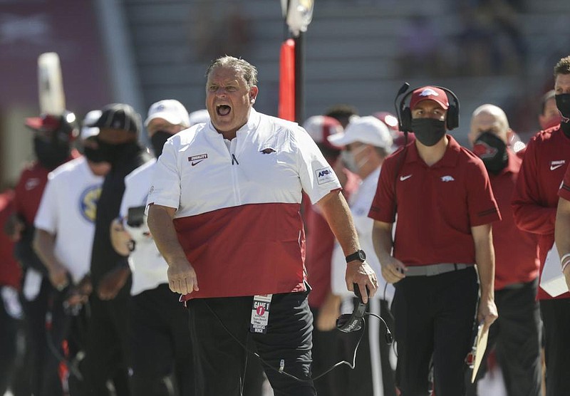 Arkansas Coach Sam Pittman roams the sidelines during Satur- day’s game, his first as head coach of the Razorbacks. (NWA Democrat-Gazette/Charlie Kaijo) 