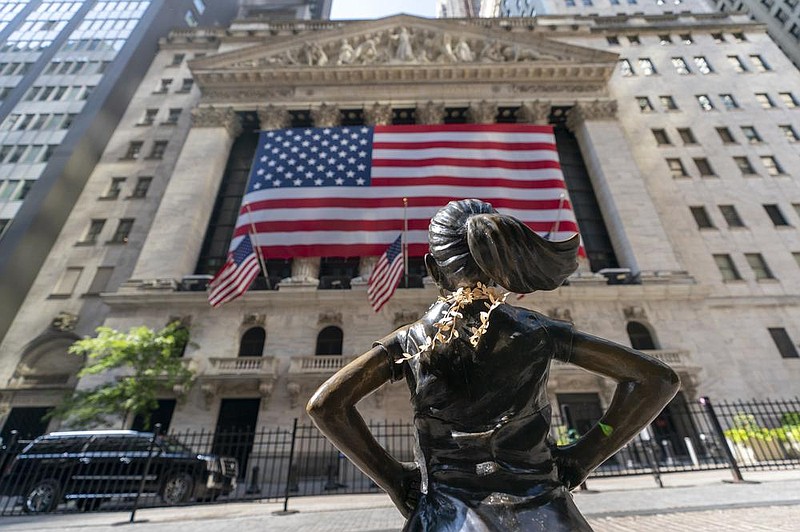 The “Fearless Girl” bronze sculpture looks toward the New York Stock Exchange Monday. (AP/Mary Altaffer)