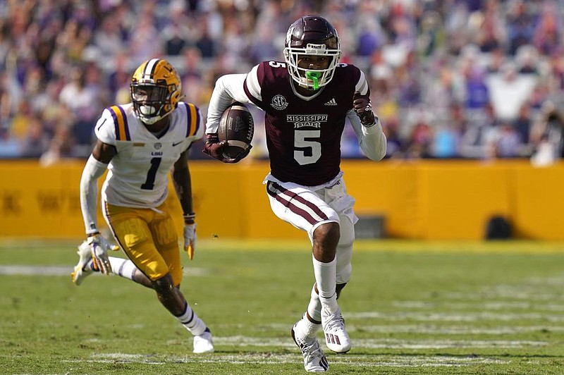 Mississippi State wide receiver Osirus Mitchell (5) runs past LSU cornerback Eli Ricks (1) during the rst half to score a touchdown in the Bulldogs’ 44- 34 victory over the No. 6 Tigers in Baton Rouge. 
(AP/Gerald Herbert) 