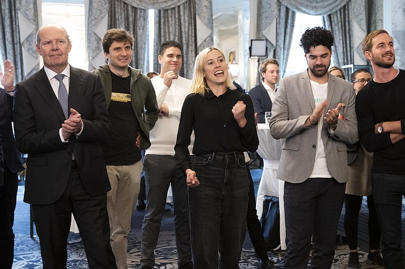 Opponents of a Swiss ballot initiative that would have restricted foreign workers celebrate its defeat Sunday in Bern, Switzer- land, at the Hotel Schweizerhof. (AP/Keystone/Peter Klaunzer) 