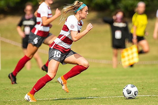 Arkansas forward Anna Podojil pushes the ball upfield during a game against LSU on Saturday, Sept. 19, 2020, in Fayetteville. 