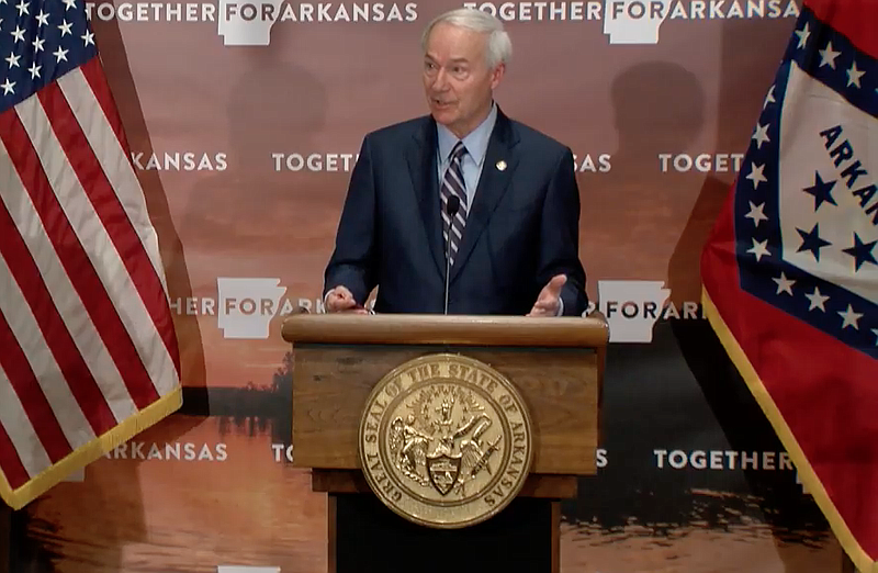 Arkansas Gov. Asa Hutchinson speaks to reporters at the state Capitol in Little Rock on Tuesday in this still of video provided by the governor's office. 