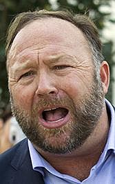 FILE- In this Sept. 5, 2018, file photo conspiracy theorist Alex Jones speaks outside of the Dirksen building of Capitol Hill in Washington. On Thursday, June 23, 2020, the Connecticut Supreme Court has upheld a sanction against the Infowars host over an angry outburst on his web show against an attorney for relatives of some of the Sandy Hook Elementary School shooting victims. (AP Photo/Jose Luis Magana, File)