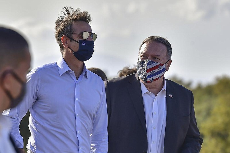 Greek Prime Minister Kyriakos Mitsotakis (left) and U.S. Secretary of State Mike Pompeo visit the archeological site of Aptera on the Greek island of Crete on Tuesday. More photos at arkansasonline. com/930pompeo/. 
(AP/Aris Messinis) 