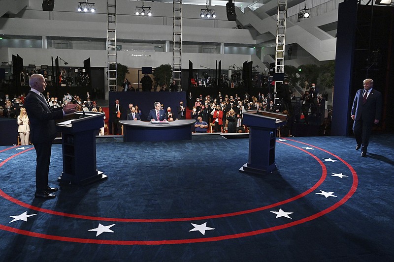 Democratic presidential candidate former Vice President Joe Biden gestures as President Donald Trump walks onto stage for the first presidential debate Tuesday, Sept. 29, 2020, at Case Western University and Cleveland Clinic, in Cleveland. story.lead_photo.caption
