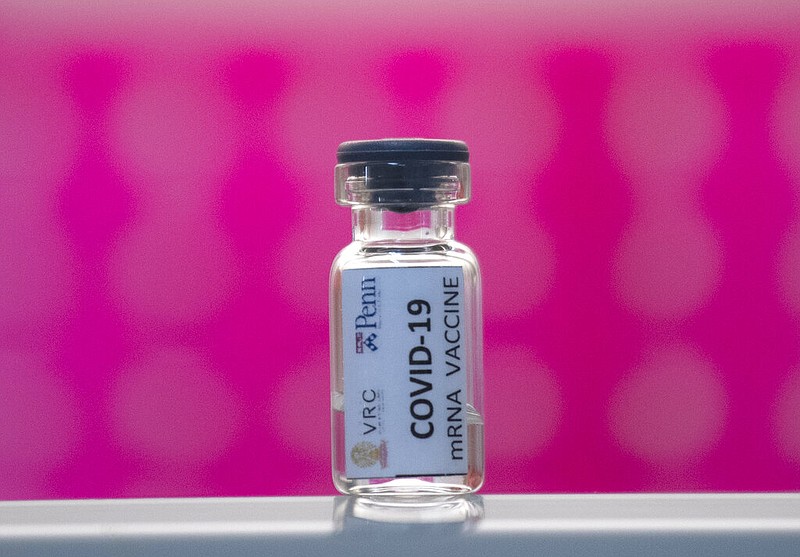 FILE - In this Monday, May 25, 2020 file photo, a vile of a covid-19 vaccine candidate on a shelf during testing at the Chula Vaccine Research Center, run by Chulalongkorn University in Bangkok, Thailand.

