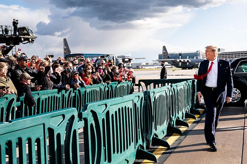 President Donald Trump greets supporters Wednesday as he makes a campaign stop in Minneapolis. He later held a campaign rally in Duluth, Minn., on the shores of Lake Superior.
(The New York Times/Erin Schaff)