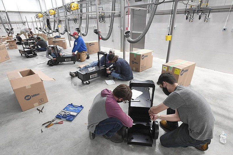 Ryan Cook (right) oif Farmington works with fellow student Seth Stubblefield of Bentonville to assemble a welding cart Wednesday Sept. 30, 2020 at Northwest Technical Institute in Springdale. The school is getting ready to open a new welding instruction building and another dedicated to ammonia and refrigeration studies. (NWA Democrat-Gazette/J.T.WAMPLER)