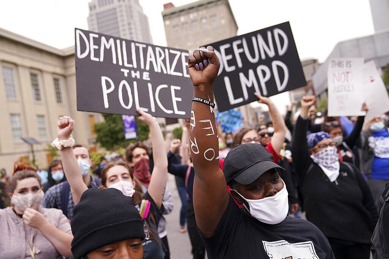 FILE - In this Sept. 23, 2020, file photo, protesters speak in Louisville, Ky. Hours of material in the grand jury proceedings for Taylor’s fatal shooting by police have been made public on Friday, Oct. 2.