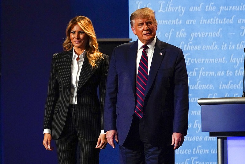 President Donald Trump stands on stage with first lady Melania Trump after the first presidential debate with Democratic presidential candidate former Vice President Joe Biden Tuesday, Sept. 29, 2020, at Case Western University and Cleveland Clinic, in Cleveland, Ohio.