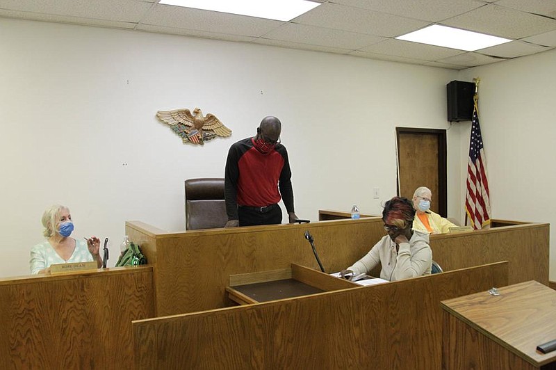 Gould City Council members Rose Dean, left, and Patricia Stephens, right, prepare for a council meeting Tuesday at Gould City Hall. Standing is Mayor Matthew Smith, and seated at center is Recorder/Treasurer Sheila Smith. 
(Pine Bluff Commercial/Dale Ellis)