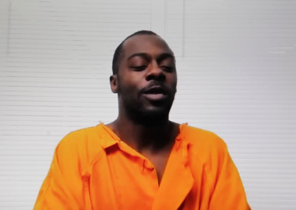 Charges read to murder suspect