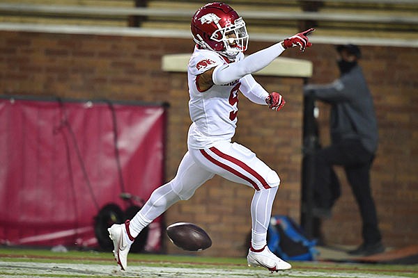 Arkansas cornerback Greg Brooks celebrates after returning an interception for a touchdown during a game against Mississippi State on Saturday, Oct. 3, 2020, in Starkville, Miss. 
