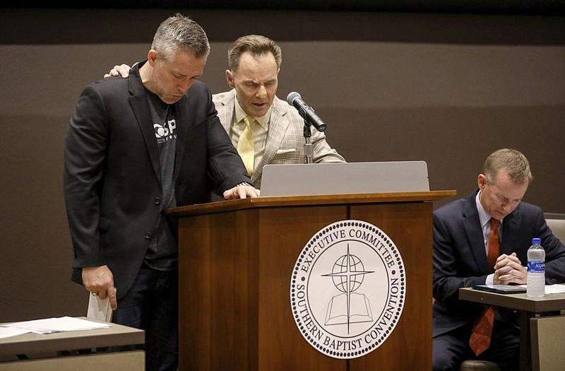 J.D. Greear (from left), president of the Southern Baptist Convention; Ronnie Floyd, president and CEO of the convention’s executive committee; and Mike Stone, chairman of the executive committee, pray during the executive committee plenary meeting at the Southern Baptist Convention on June 10, 2019, in Birmingham, Ala. Greear and Floyd are among those in the growing movement to adopt the name “Great Commission Baptists” in place of “Southern Baptist” because of racial unrest and the regional limits of its current name.
(Houston Chronicle via AP/Jon Shapley)