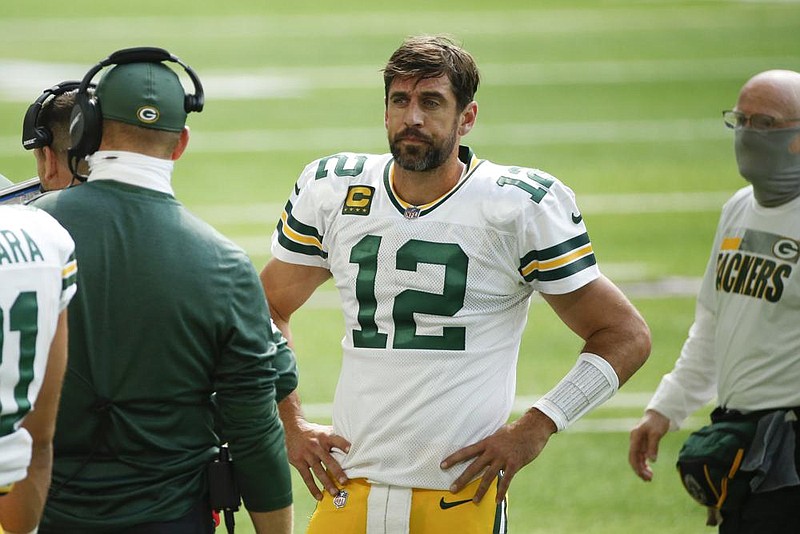 Green Bay Packers quarterback Aaron Rodgers watches from the sideline during the first half of an NFL football game against the Minnesota Vikings, Sunday, Sept. 13, 2020, in Minneapolis. (AP Photo/Bruce Kluckhohn)