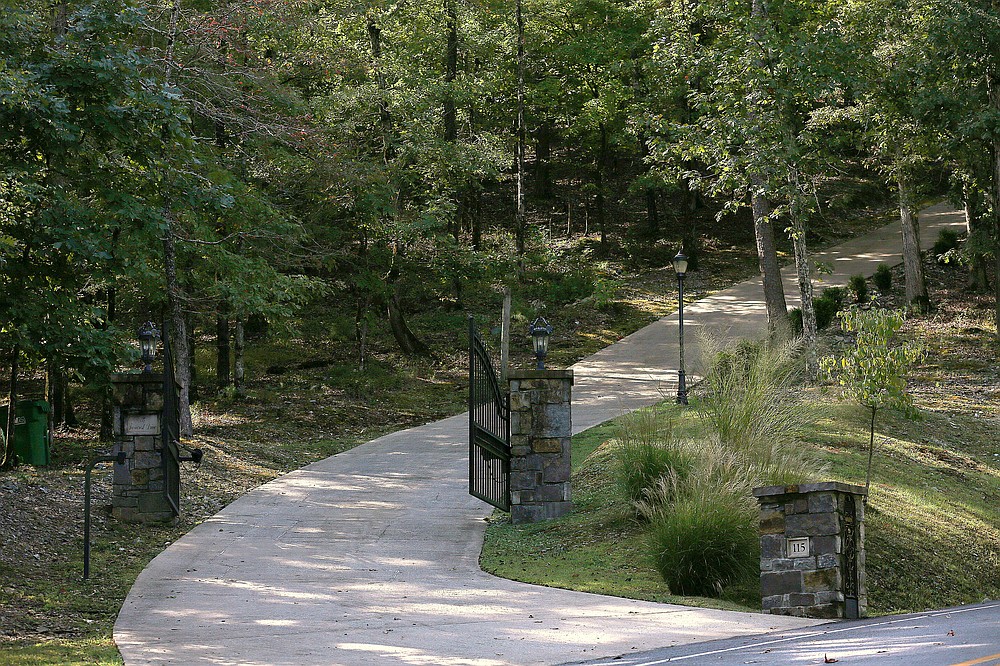 115 Ferncrest Drive -- Owned by Brenda and Willie Godwin and the Godwin Trust, a house behind this gate was sold to Kandi K. and D. Marc Holmes for $732,000.