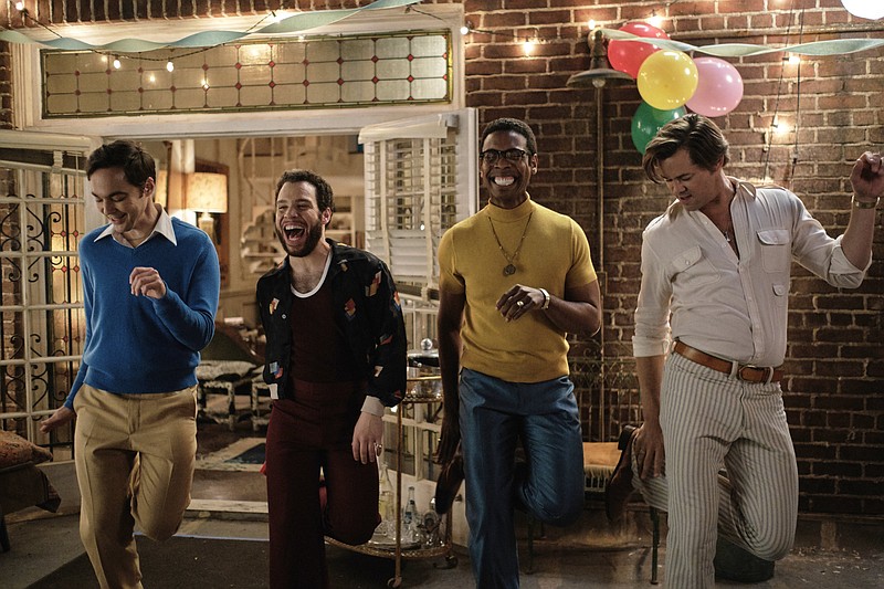 Jim Parsons (from left), Robin De Jesus, Michael Benjamin Washington and Andrew Rannells kick up their heels in a scene from remade “The Boys in the Band.” The new movie kept the original’s hurtful language.

(Netflix via AP/Scott Everett White)