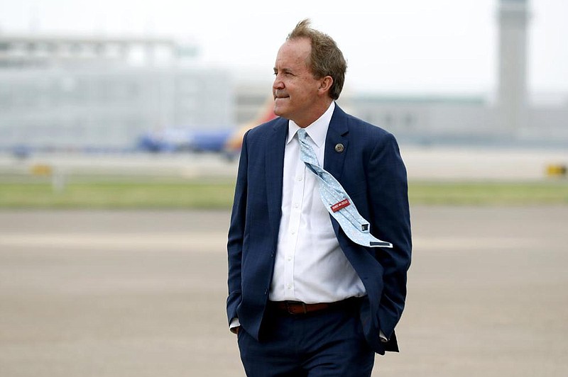 Texas Attorney General Ken Paxton, shown in June while awaiting the arrival of Vice President Mike Pence at Love Field in Dallas, has raised his national profile for his efforts in support of conservative causes under President Donald Trump.
(AP/Tony Gutierrez)