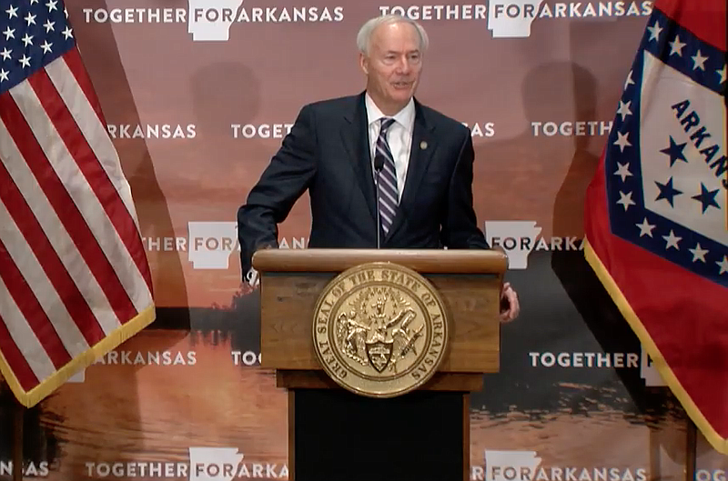 Arkansas Gov. Asa Hutchinson speaks to reporters at the state Capitol in Little Rock on Tuesday in this still of video provided by the governor's office. 