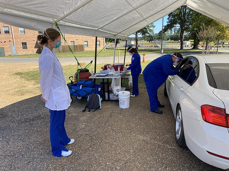 SAU Nursing and Public Health students provide vaccines during an ADH sponsored drive though clinic.