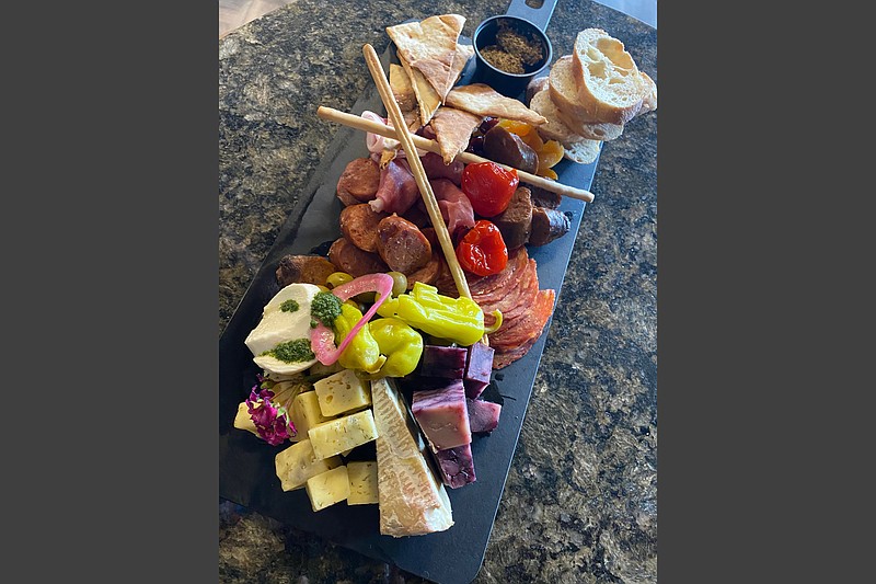 Cannibal & Craft opens Oct. 23 at 307 President Clinton Ave. in Little Rock’s River Market. The menu includes a charcuterie board featuring wild game sausage, artisan meats and cheeses, dried fruit and assorted flatbreads. 
(Special to the Democrat-Gazette)