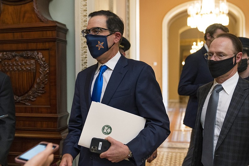 Treasury Secretary Steven Mnuchin makes a brief comment as he leaves the Capitol in this Sept. 30, 2020, file photo. Mnuchin had earlier met with House Speaker Nancy Pelosi of California.