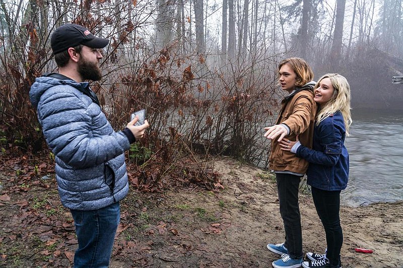 Director Brian Duffield works with his young stars Charlie Plummer and Katherine Langford on the set of “Spontaneous.”