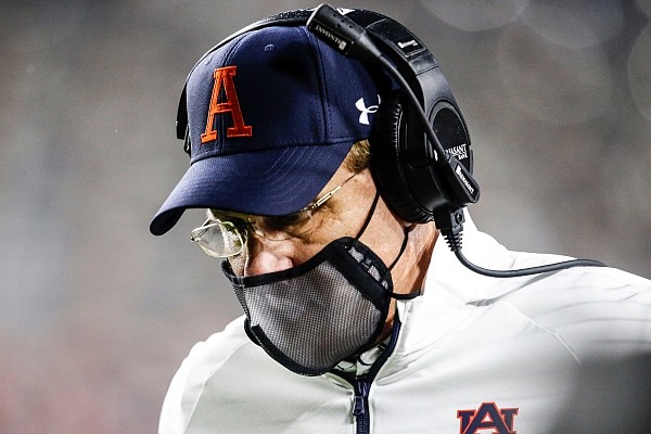 Auburn coach Gus Malzahn walks the sideline during the second half of the team's NCAA college football game against Arkansas on Saturday, Oct. 10, 2020, in Auburn, Ala. (AP Photo/Butch Dill) Auburn coach Gus Malzahn walks the sideline during the second half of the team's NCAA college football game against Arkansas on Saturday, Oct. 10, 2020, in Auburn, Ala. (AP Photo/Butch Dill)