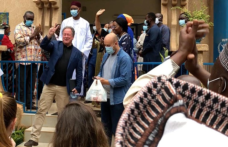 David Beasley (maskless, second from left), executive director of the World Food Program, celebrates with members of his staff Friday in Niamey, Niger, after the agency was awarded the 2020 Nobel Peace Prize. More photos at arkansasonline.com/1010worldfood/.
(AP/World Food Program)