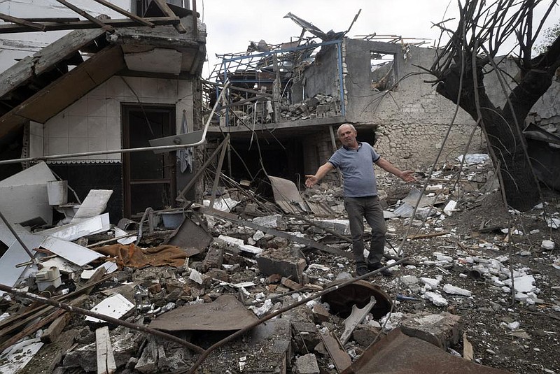 A man checks out the damage Friday at a house destroyed by shelling by Azerbaijan’s artillery in Stepanakert, the separatist region of Nagorno-Karabakh. More photos at arkansasonline.com/1010nagorno/.
(AP)