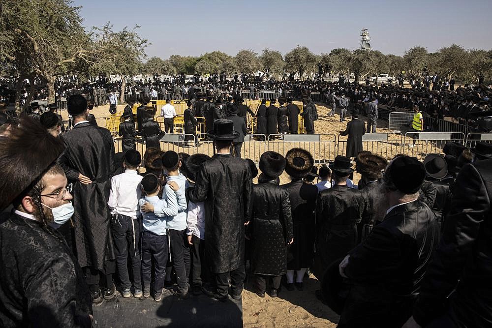 Large numbers of ultra-Orthodox Jews gather Monday for the funeral for Rabbi Mordechai Leifer, in the port city of Ashdod, Israel. After a revered ultra-Orthodox rabbi died this week, Israeli police thought they had worked out an arrangement with his followers to allow a small but dignified funeral that would conform with public health guidelines under the current coronavirus lockdown.
(AP/Tsafrir Abayov)