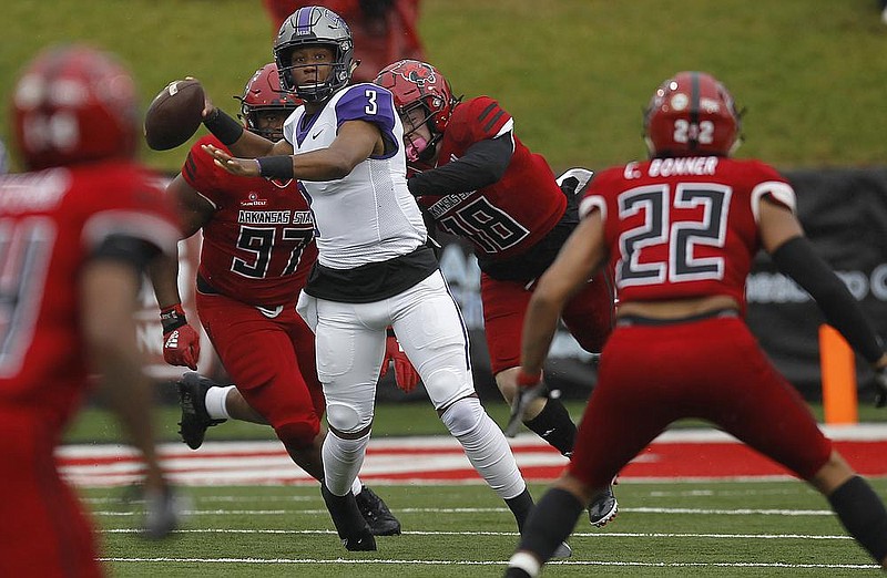 In this Oct. 10, 2020 file photo Central Arkansas quarterback Breylin Smith (3) throws a pass while being pressured by Arkansas State defenders at Centennial Bank Stadium in Jonesboro. 
(Arkansas Democrat-Gazette/Thomas Metthe)