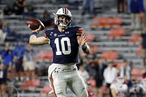 Auburn quarterback Bo Nix throws a pass during a game against Arkansas on Saturday, Oct. 10, 2020, in Auburn, Ala. (AP Photo/Butch Dill)
Auburn quarterback Bo Nix throws a pass during a game against Arkansas on Saturday, Oct. 10, 2020, in Auburn, Ala. (AP Photo/Butch Dill)