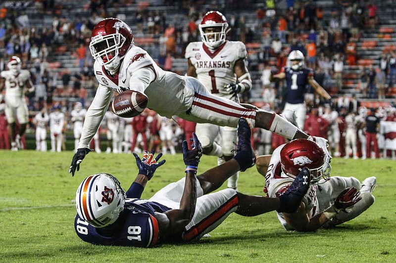 Arkansas defensive back Hudson Clark breaks up a pass intended for Auburn wide receiver Seth Williams (18) during the second half of an NCAA college football game Saturday, Oct. 10, 2020, in Auburn, Ala. (AP Photo/Butch Dill)