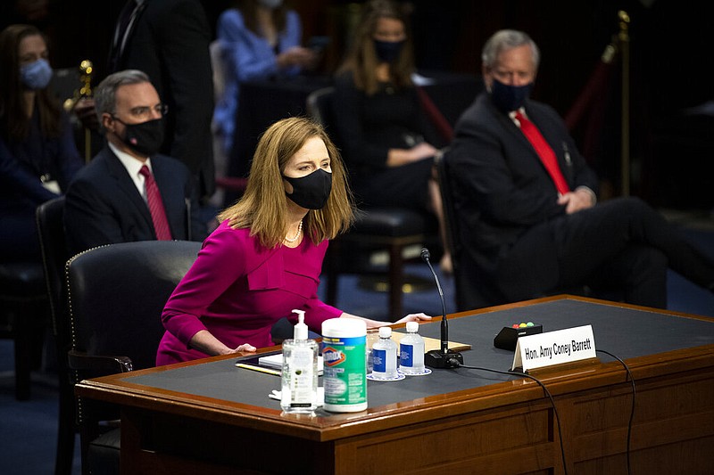 Supreme Court nominee Amy Coney Barrett arrives for her Senate Judiciary Committee confirmation hearing on Capitol Hill in Washington, Monday, Oct. 12, 2020.