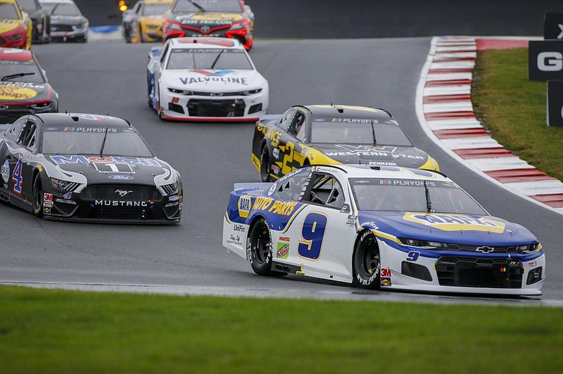 Chase Elliott leads the way out of turn 7 as he competes in Sun- day’s NASCAR Cup Series race at Charlotte Motor Speedway in Concord, N.C.. Elliott won to advance to the round of eight for the fourth consecutive year. More photos at arkansasonline. com/1012nascar/ 
(AP/Nell Redmond) 