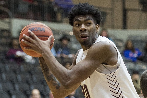 UALR forward Kamani Johnson (20) looks for a teammate to pass to during a game against Texas-Arlington on Saturday, Jan. 4, 2020, at Jack Stephens Center in Little Rock.
