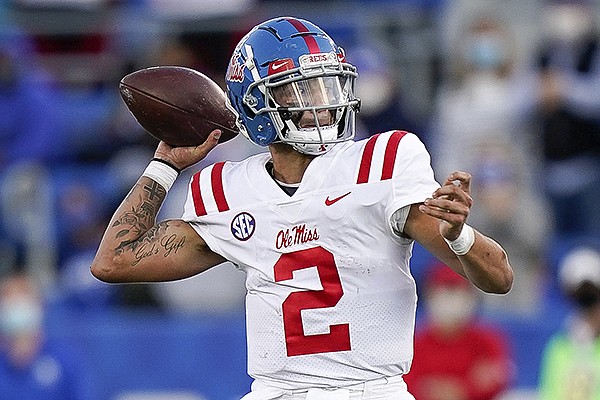 Ole Miss quarterback Matt Corral (2) throws the ball during the second half of an NCAA college football game against Kentucky, Saturday, Oct. 3, 2020, in Lexington, Ky. (AP Photo/Bryan Woolston)