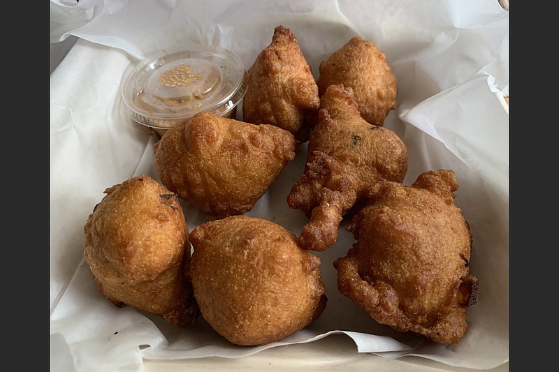 The enormous, puffy hush puppies are on the veggie/vegan and omnivore sides of Esters’ menu.

(Arkansas Democrat-Gazette/Eric E. Harrison)