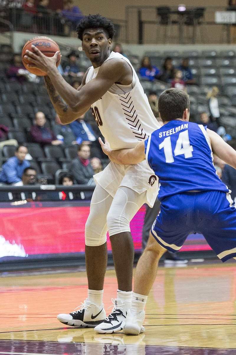 Former UALR forward Kamani Johnson (left) announced Tuesday he will transfer to Arkansas. He was a third team All-Sun Belt selection as a sophomore last season. (Arkansas Democrat-Gazette file photo) 