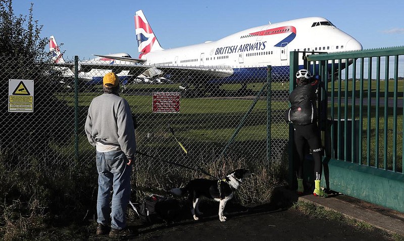 Retired British Airways Boeing 747-400s are parked Sunday at Cotsworld Airport in Kemble, Eng- land. (AP/Frank Augstein) 