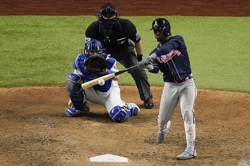 Ozzie Albies of the Atlanta Braves hits a home run against the Los Angeles Dodgers during the ninth inning of the Braves’ 8-7 victory in Game 2 of the National League Championship Series. Albies went 3 for 4 with 2 RBI as the Braves took a 2-0 series lead. (AP/Sue Ogrocki) 