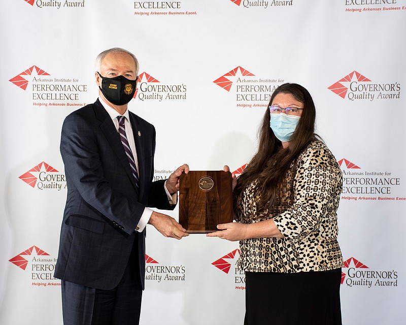 Governor Asa Hutchinson presented the Governor’s Quality Award to Elaine Butler, MCSA Director of Quality, at a small luncheon recently, where attendance was limited and social distancing protocols followed, according to an Arkansas Institute for Performance Excellence press release. (Contributed) story.lead_photo.caption
