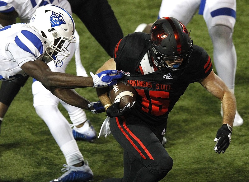 Arkansas State wide receiver Brandon Bowling (16) shakes off Georgia State cornerback Jaylon Jones (27) for a 16-yard touchdown during the third quarter of the Red Wolves' 59-52 win on Thursday, Oct. 15, 2020, at Centennial Bank Stadium in Jonesboro. See more photos at arkansasonline.com/1016asu/