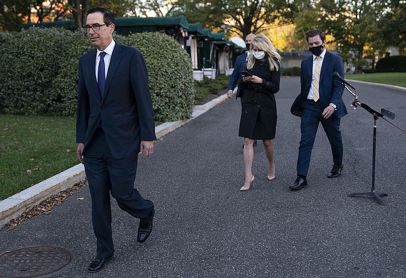 Treasury Secretary Steven Mnuchin walks away Wednesday outside the White House after speaking with reporters about negotiations on another coronavirus relief package. Mnuchin criticized House Speaker Nancy Pelosi’s “all or nothing” approach, saying they should act immediately to help specific sectors. More photos at arkansasonline.com/1015stimulus/. 
(AP/Evan Vucci) 